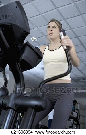Picture - Woman working out. Fotosearch