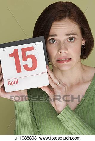 Woman worried about tax deadline View Large Photo Image Stock Photo - Woman worried about tax deadline. Fotosearch