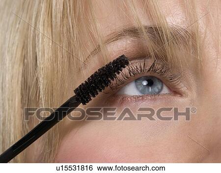 Woman's eye with mascara brush View Large Photo Image Stock Photograph - Woman's eye with mascara brush. Fotosearch