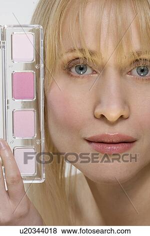 Stock Photo - Woman's face with pink cosmetics. Fotosearch