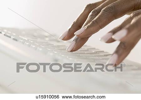 Woman's hands on a computer keyboard View Large Photo Image Stock Photograph - Woman's hands on a computer keyboard. Fotosearch