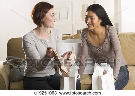 Women friends chatting after shopping View Large Photo Image Stock Image - Women friends chatting after shopping. Fotosearch