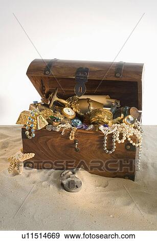 Wooden chest overflowing with treasure View Large Photo Image Stock Photo - Wooden chest overflowing with treasure. Fotosearch