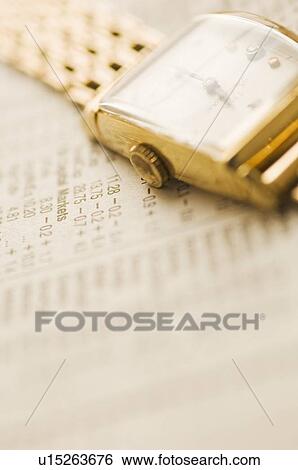 Wristwatch and stock figures View Large Photo Image Stock Photograph - Wristwatch and stock figures. Fotosearch