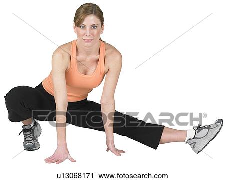 Young woman exercising View Large Photo Image Stock Image - Young woman exercising. Fotosearch