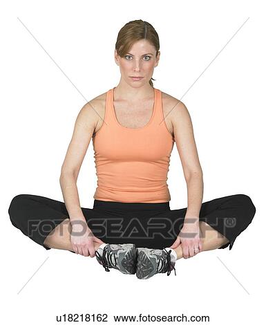 Young woman exercising View Large Photo Image Stock Image - Young woman exercising. Fotosearch