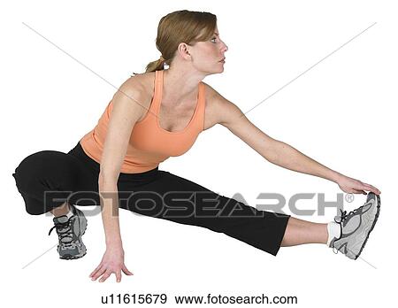 Stock Photo - Young woman exercising. Fotosearch