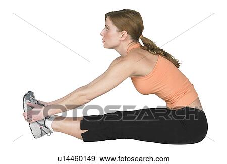Stock Photo - Young woman exercising. Fotosearch