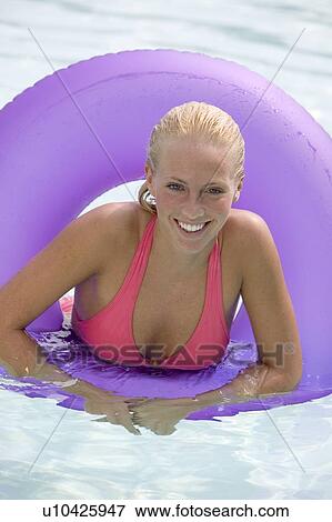 Young woman in a swimming pool View Large Photo Image Stock Photo - Young woman in a swimming pool. Fotosearch