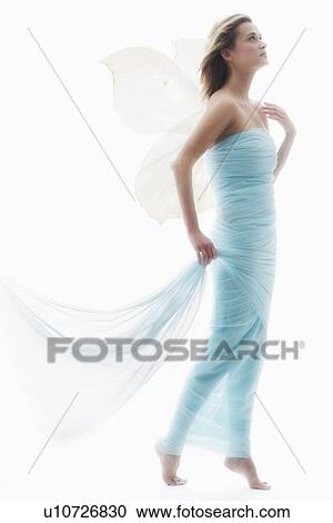 Stock Image - Young woman in full length gown. Fotosearch