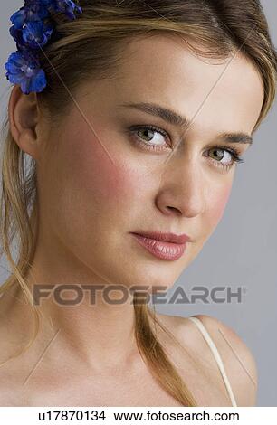 Picture - Young woman wearing a hair ornament. Fotosearch