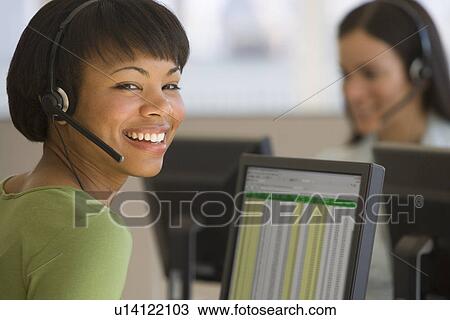 African businesswoman wearing headset View Large Photo Image Stock Image - African businesswoman wearing headset. Fotosearch