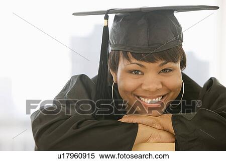 African woman wearing graduation cap and gown View Large Photo Image Stock Photography - African woman wearing graduation cap and gown. Fotosearch