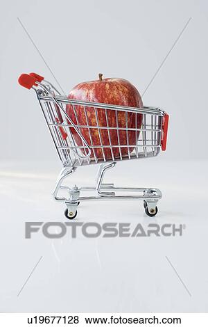 Apple in shopping cart View Large Photo Image Stock Photo - Apple in shopping cart. Fotosearch