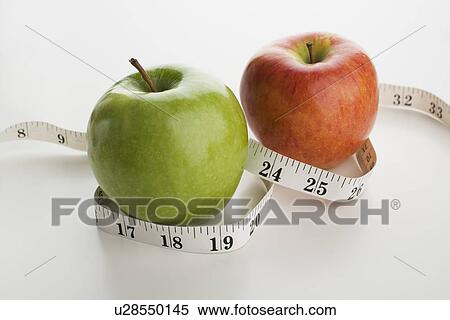 Stock Photography - Apples and tape measure. Fotosearch
