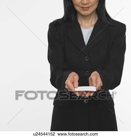Asian businesswoman offering business card View Large Photo Image Stock Image - Asian businesswoman offering business card. Fotosearch