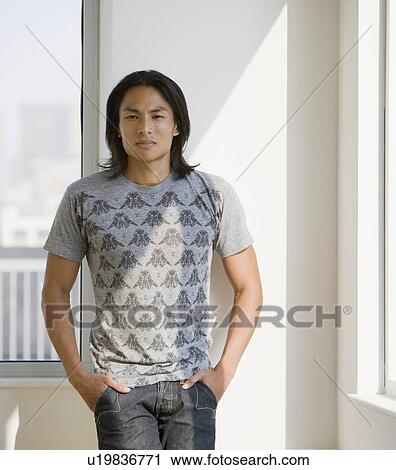 Asian man with hands in pockets View Large Photo Image Stock Image - Asian man with hands in pockets. Fotosearch