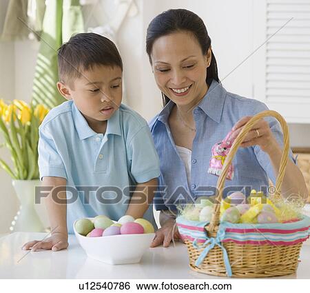 Asian mother and son making Easter basket View Large Photo Image Stock Photograph - Asian mother and son making Easter basket. Fotosearch
