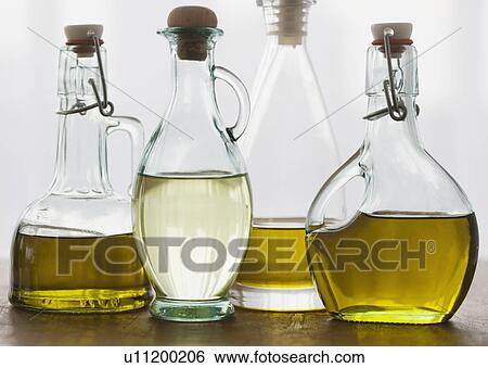 Assorted bottles of oil View Large Photo Image Stock Photograph - Assorted bottles of oil. Fotosearch