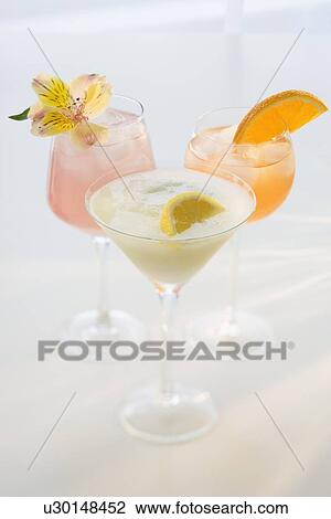 Assorted cocktails on table View Large Photo Image Stock Image - Assorted cocktails on table. Fotosearch