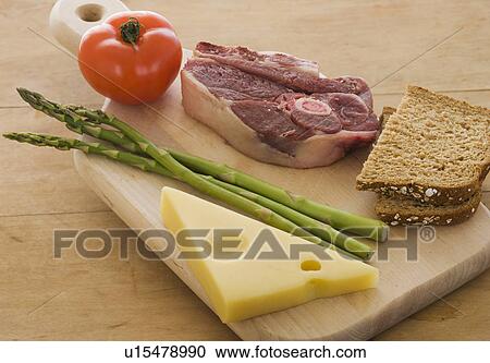 Assorted food groups on cutting board View Large Photo Image Stock Image - Assorted food groups on cutting board. Fotosearch