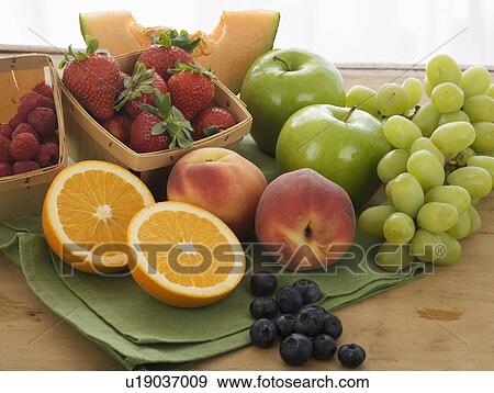 Assorted fruit on table View Large Photo Image Stock Photo - Assorted fruit on table. Fotosearch