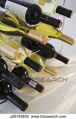 Assorted wine bottles on wine rack View Large Photo Image Picture - Assorted wine bottles on wine rack. Fotosearch