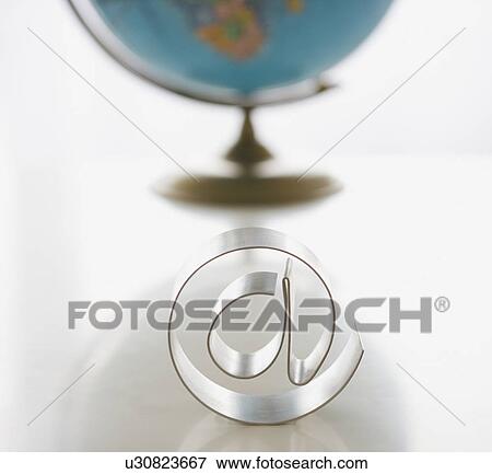 At symbol in front of globe View Large Photo Image Stock Photo - At symbol in front of globe. Fotosearch