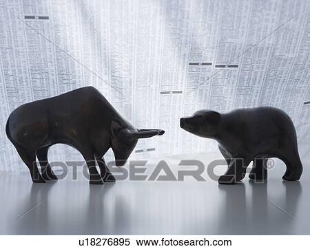 Stock Photography - Bear and bull figurines facing each other. Fotosearch