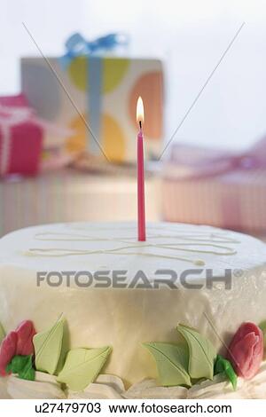 Stock Image - Birthday cake with candle. Fotosearch