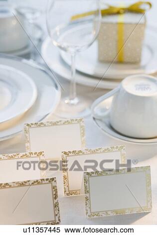 Stock Photography - Blank cards next to dishes on table. Fotosearch