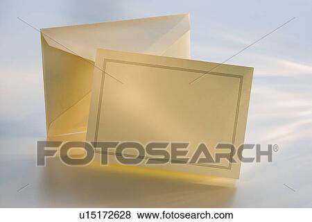 Stock Photo - Blank invitation and envelope on table. Fotosearch
