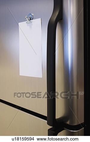 Picture - Blank note on refrigerator. Fotosearch