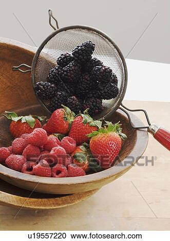 Stock Image - Bowl of assorted berries. Fotosearch