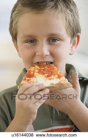 Boy eating pizza View Large Photo Image Stock Photo - Boy eating pizza. Fotosearch