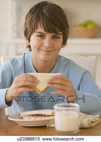 Boy eating sandwich View Large Photo Image Stock Image - Boy eating sandwich. Fotosearch