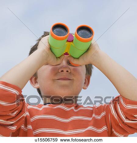Stock Photo - Boy looking through binoculars. Fotosearch