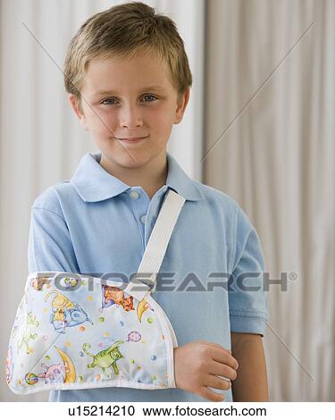 Boy with arm in sling View Large Photo Image Stock Image - Boy with arm in sling. Fotosearch
