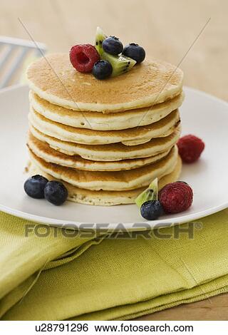 Stock Photograph - Breakfast plate with pancakes and fruit. Fotosearch