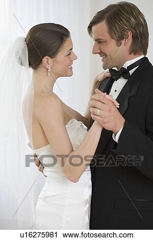 Stock Image - Bride and groom dancing. Fotosearch