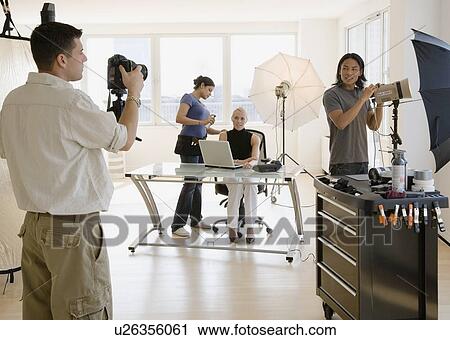 Business photo shoot in studio View Large Photo Image Stock Image - Business photo shoot in studio. Fotosearch