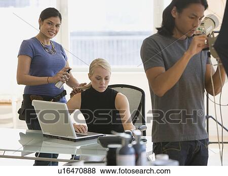 Stock Photo - Business photo shoot in studio. Fotosearch