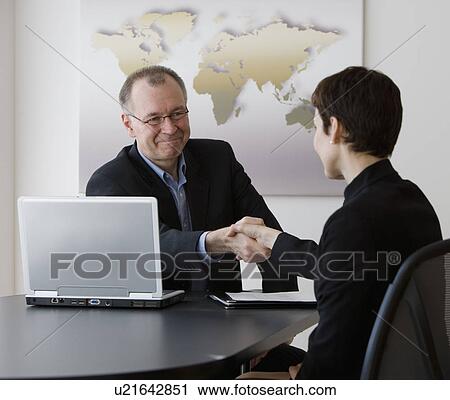 Businessman and businesswoman shaking hands View Large Photo Image Stock Image - Businessman and businesswoman shaking hands. Fotosearch