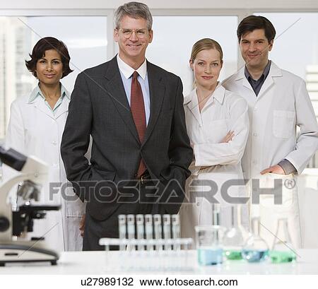 Businessman and scientists in laboratory View Large Photo Image Stock Image - Businessman and scientists in laboratory. Fotosearch
