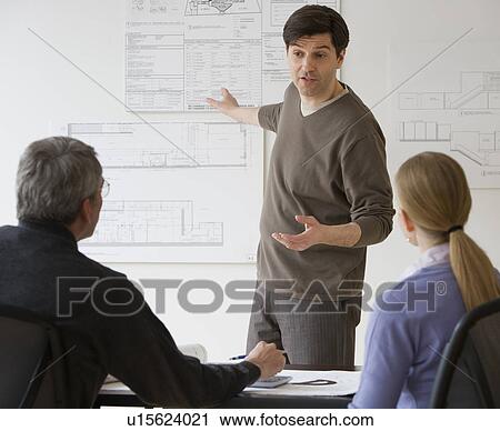 Stock Image - Businessman giving presentation. Fotosearch