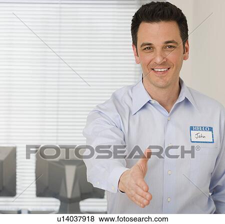 Businessman reaching out to shake hands View Large Photo Image Stock Photo - Businessman reaching out to shake hands. Fotosearch