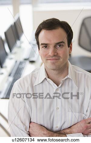Picture - Businessman with arms crossed. Fotosearch