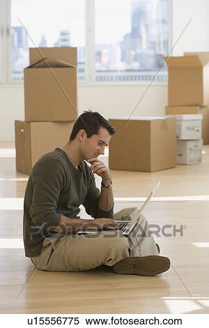Businessman working in new office View Large Photo Image Stock Photography - Businessman working in new office. Fotosearch