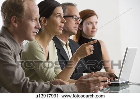 Businesspeople at meeting View Large Photo Image Stock Image - Businesspeople at meeting. Fotosearch