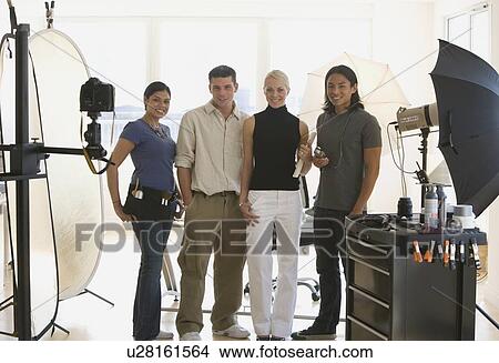 Picture - Businesspeople at photo shoot in studio. Fotosearch